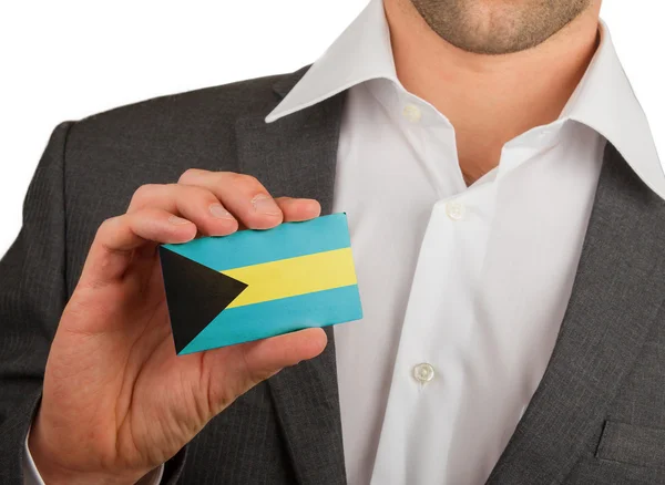 Businessman is holding a business card, The Bahamas — Stock Photo, Image