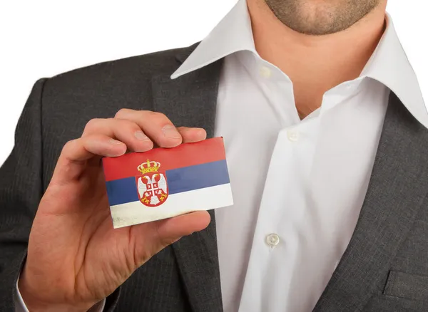 Businessman is holding a business card, Serbia — Stock Photo, Image