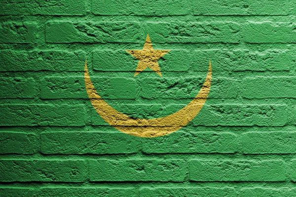 Ziegelsteinmauer mit einem Bild einer Flagge, Mauretanien — Stockfoto