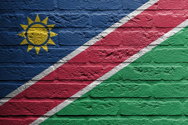 Mur de briques avec une peinture d'un drapeau, Namibie — Photo