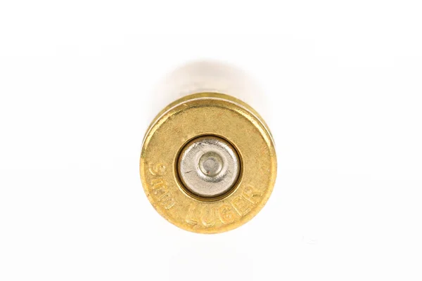 Empty shell casing against gradient — Stock Photo, Image