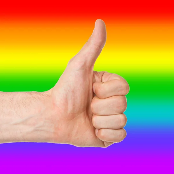 Image of a mans hand showing thumb up, rainbow flag — Stock Photo, Image