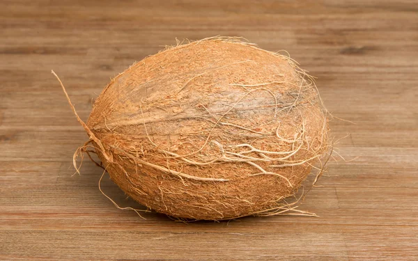 Coconut on wood — Stock Photo, Image