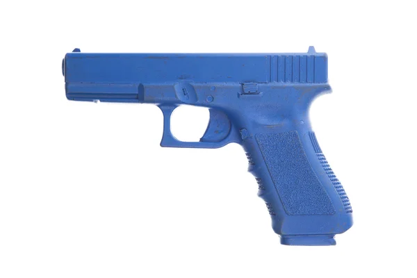 Pistolet d'entraînement bleu sale isolé sur blanc — Photo