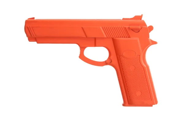 Pistola de entrenamiento sucia roja aislada en blanco — Foto de Stock