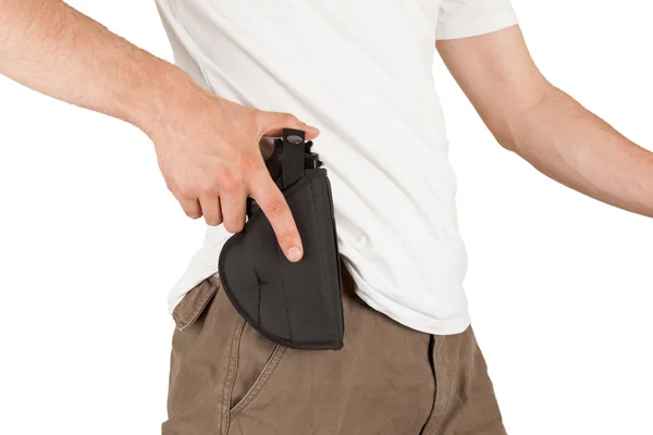 Close-up of a man with his hand on a gun — Stock Photo, Image