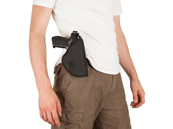 Close-up de um homem com coldre e uma arma — Fotografia de Stock