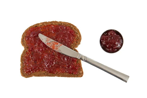 Scheibe braunes Brot mit Marmelade — Stockfoto