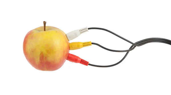 Видеокабели на яблоке — стоковое фото