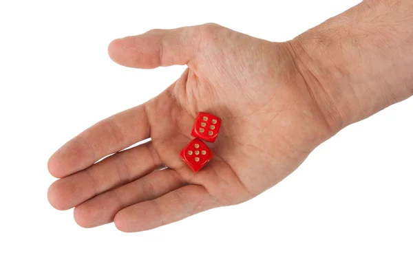 Hand som håller röda tärningar — Stockfoto