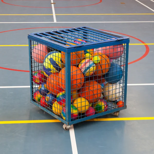 Collection of different balls in a metal cage — Stock Photo, Image