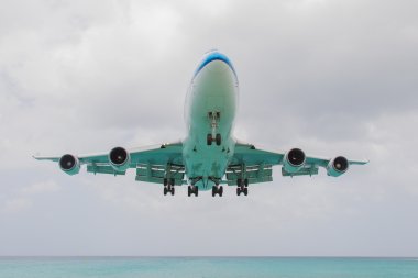 ST MARTIN, ANTILLES - JULY 19, 2013: Boeing 747 aircraft in is l clipart
