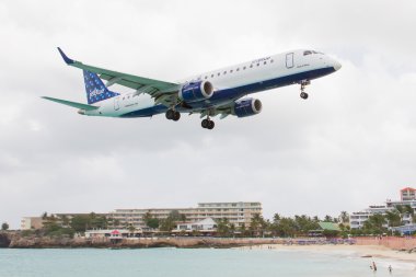ST MARTIN, ANTILLES - JULY 19, 2013: JetBlue is the fastest grow clipart