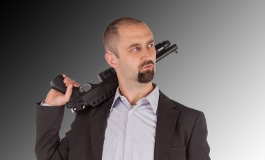 Mafia man is holding a shotgun clipart