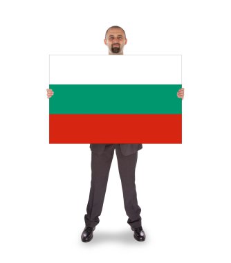 büyük bir kart, Bulgaristan bayrağı tutarak gülümseyen iş adamı