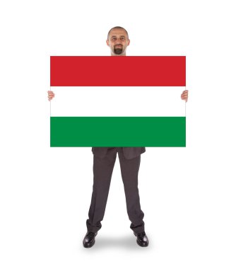 büyük bir kart, Macaristan bayrağı tutarak gülümseyen iş adamı