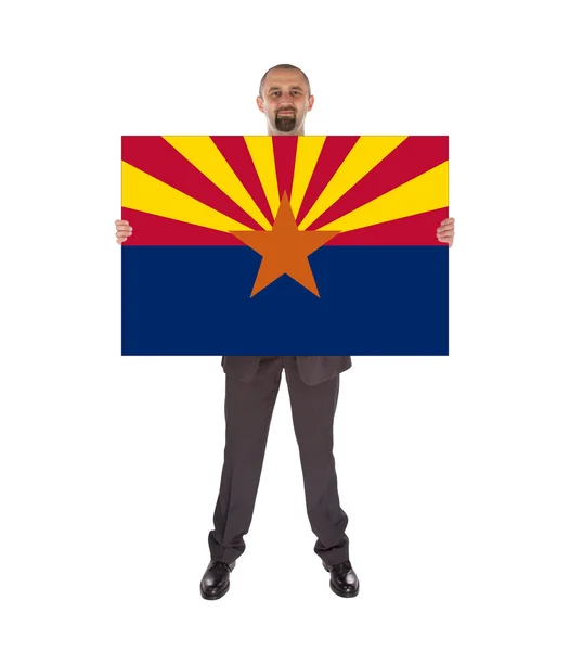 Smiling businessman holding a big card, flag of Arizona — Stock Photo, Image