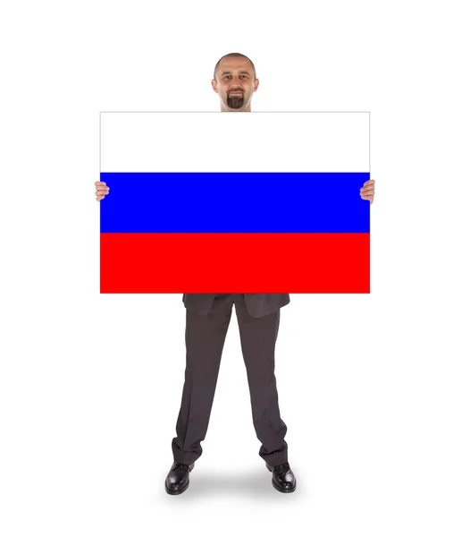 Lächelnder Geschäftsmann mit großer Karte, Flagge Russlands — Stockfoto