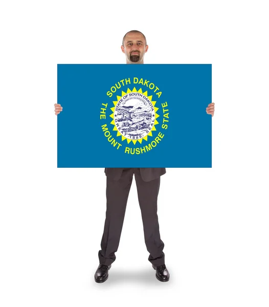 Smiling businessman holding a big card, flag of South Dakota — Stock Photo, Image