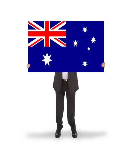 Smiling businessman holding a big card, flag of Australia — Stock Photo, Image