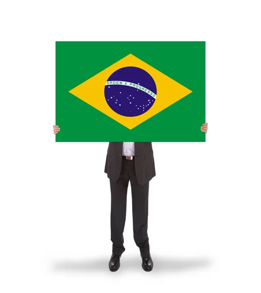 Smiling businessman holding a big card, flag of Brazil — Stock Photo, Image