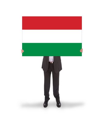 büyük bir kart, Macaristan bayrağı tutarak gülümseyen iş adamı