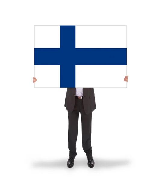 Lächelnder Geschäftsmann mit einer großen Karte, der Flagge Finnlands — Stockfoto