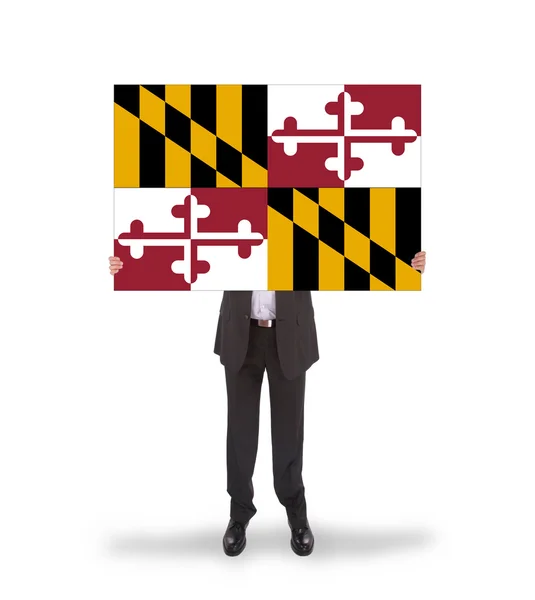 Smiling businessman holding a big card, flag of Maryland — Stock Photo, Image