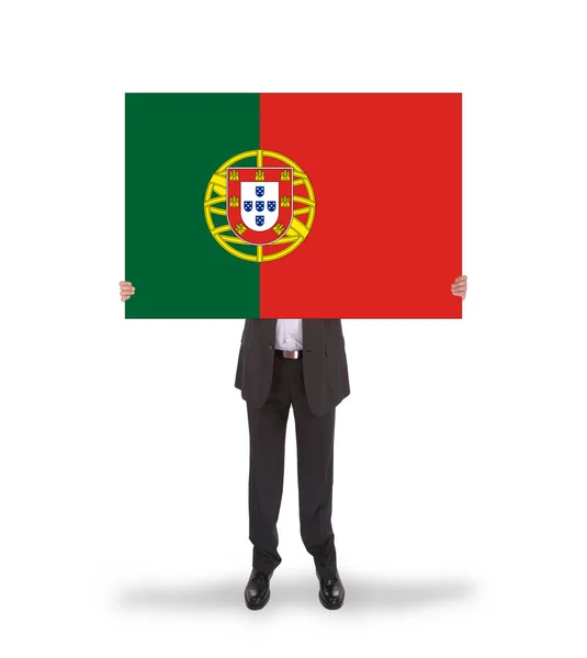 Hombre de negocios sonriente sosteniendo una tarjeta grande, bandera de Portugal —  Fotos de Stock