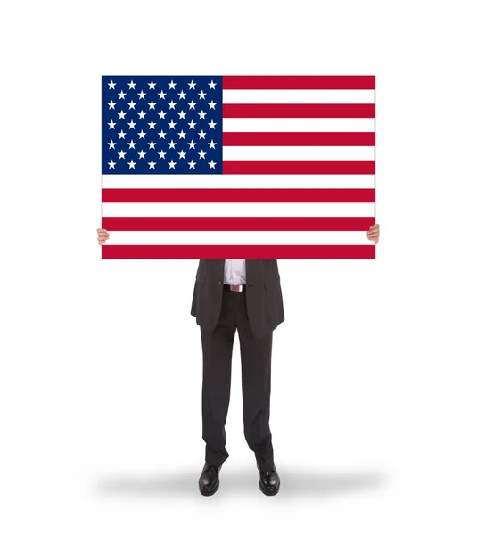 Smiling businessman holding a big card, flag of the United State — Stock Photo, Image