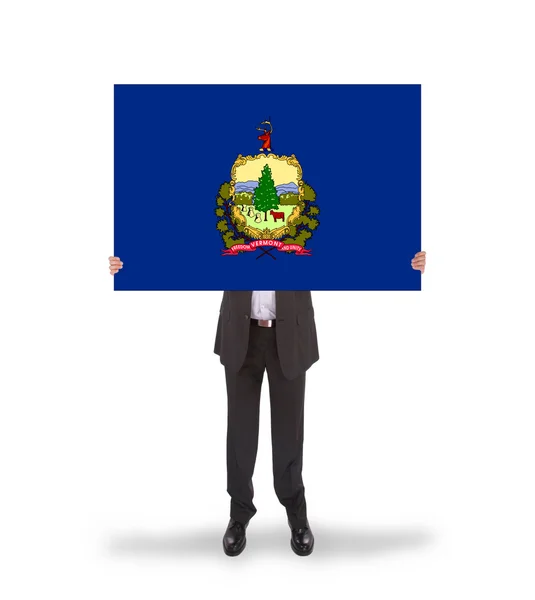 Smiling businessman holding a big card, flag of Vermont — Stock Photo, Image