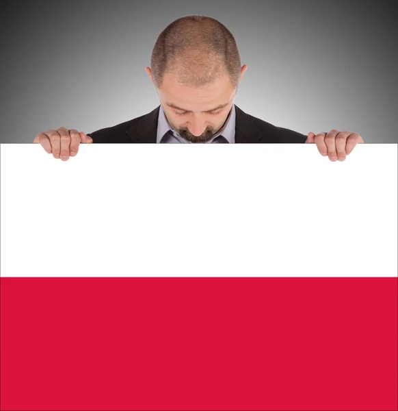 Lachende zakenman met een grote kaart, vlag van Polen — Stockfoto