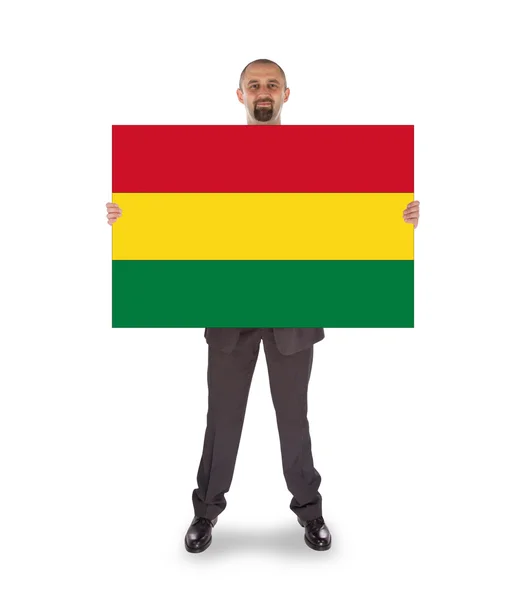 Zakenman met een grote kaart, vlag van bolivia — Stockfoto