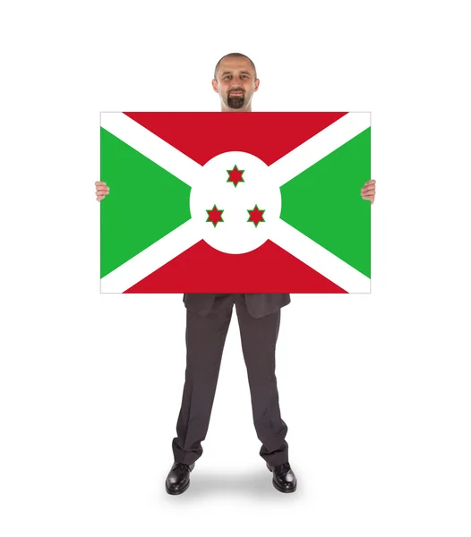 Businessman holding a big card, flag of Burundi — Stock Photo, Image