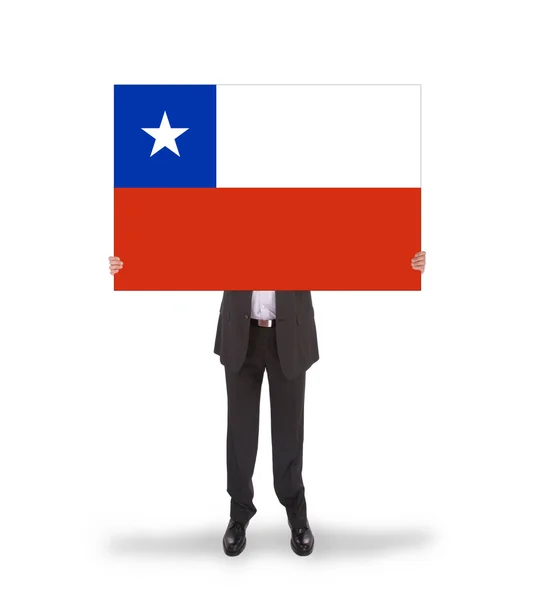 Businessman holding a big card, flag of Chile — Stock Photo, Image