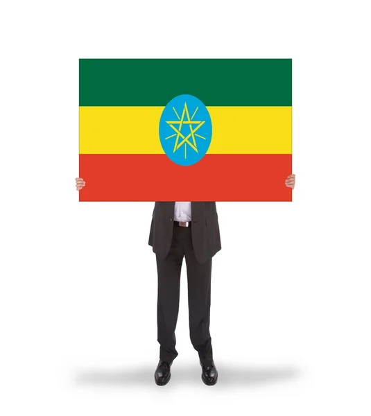 Homme d'affaires tenant une grande carte, drapeau de l'Ethiopie — Photo