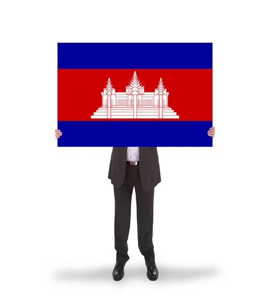 Empresario sosteniendo una gran tarjeta, bandera de Camboya —  Fotos de Stock