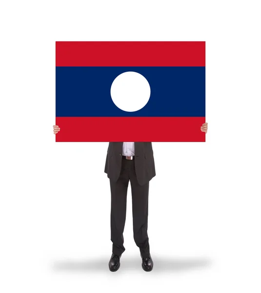 Businessman holding a big card, flag of Laos — Stock Photo, Image