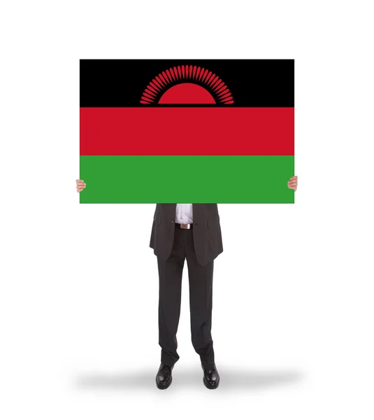 Biznesmen gospodarstwa duże karty, flaga malawi — Zdjęcie stockowe