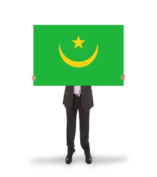 Empresario con una tarjeta grande, bandera de Mauritania —  Fotos de Stock