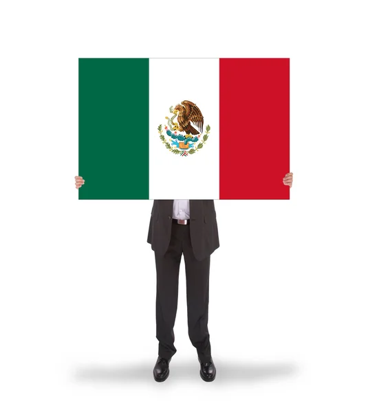 Empresário segurando um cartão grande, bandeira do México — Fotografia de Stock