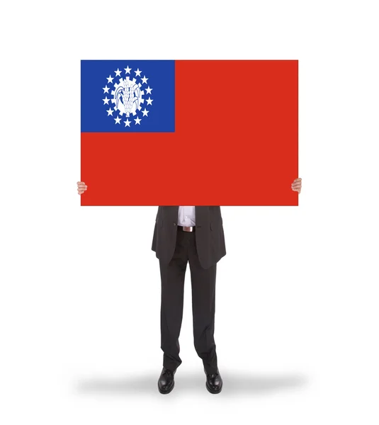 Businessman holding a big card, flag of Myanmar — Stock Photo, Image