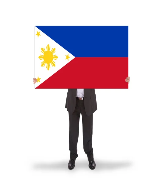 Businessman holding a big card, flag of Philippines — Stock Photo, Image