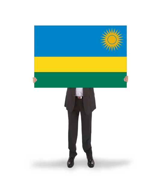 Homme d'affaires tenant une grande carte, drapeau du Rwanda — Photo