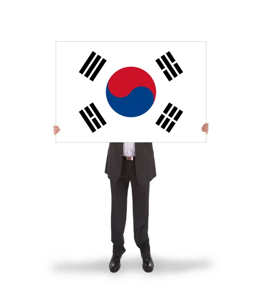 Işadamı tutarak büyük bir kart, Güney Kore bayrağı — Stok fotoğraf