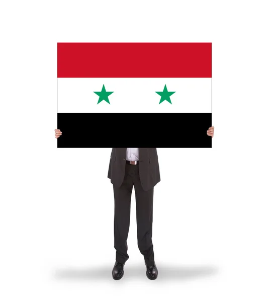 Suriye bayrağı, büyük bir kartı tutan işadamı — Stok fotoğraf