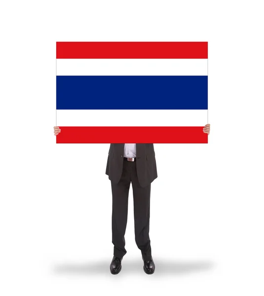 Uomo d'affari in possesso di una grande carta, bandiera della Thailandia — Foto Stock