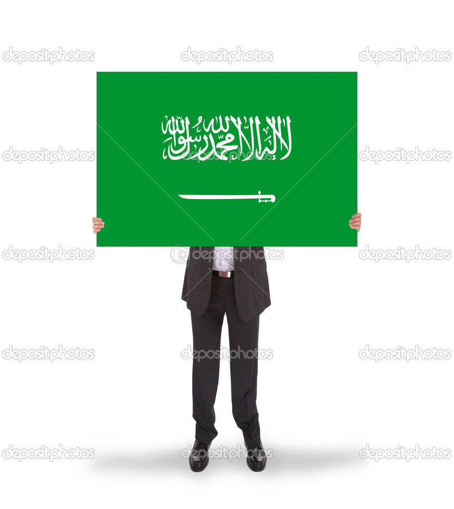Businessman holding a big card, flag of Saudi Arabia