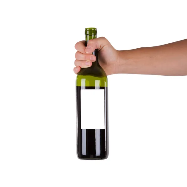 Ręka trzyma butelkę czerwonego wina — Zdjęcie stockowe