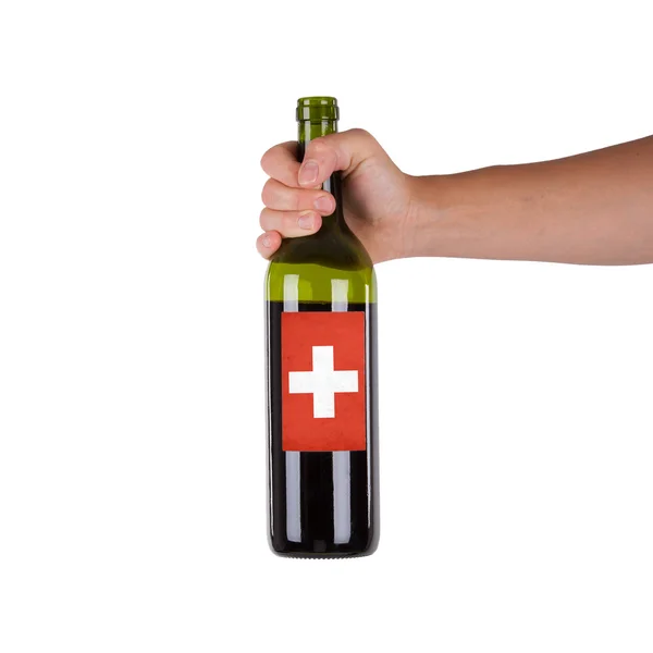 Hand holding a bottle of red wine — Stock Photo, Image